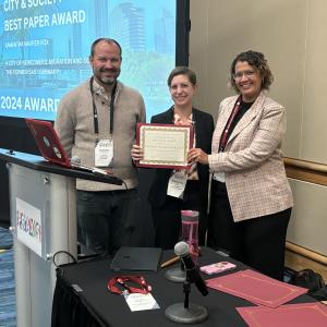 Dr Samantha Fox is pictured with City and Society editor Kristin Monroe and Executive Editor Andrew Newman